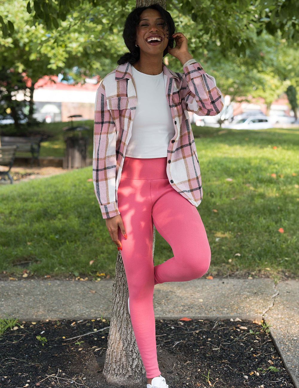 model wearing the solid pink fleece lined leggings with a pink shacket