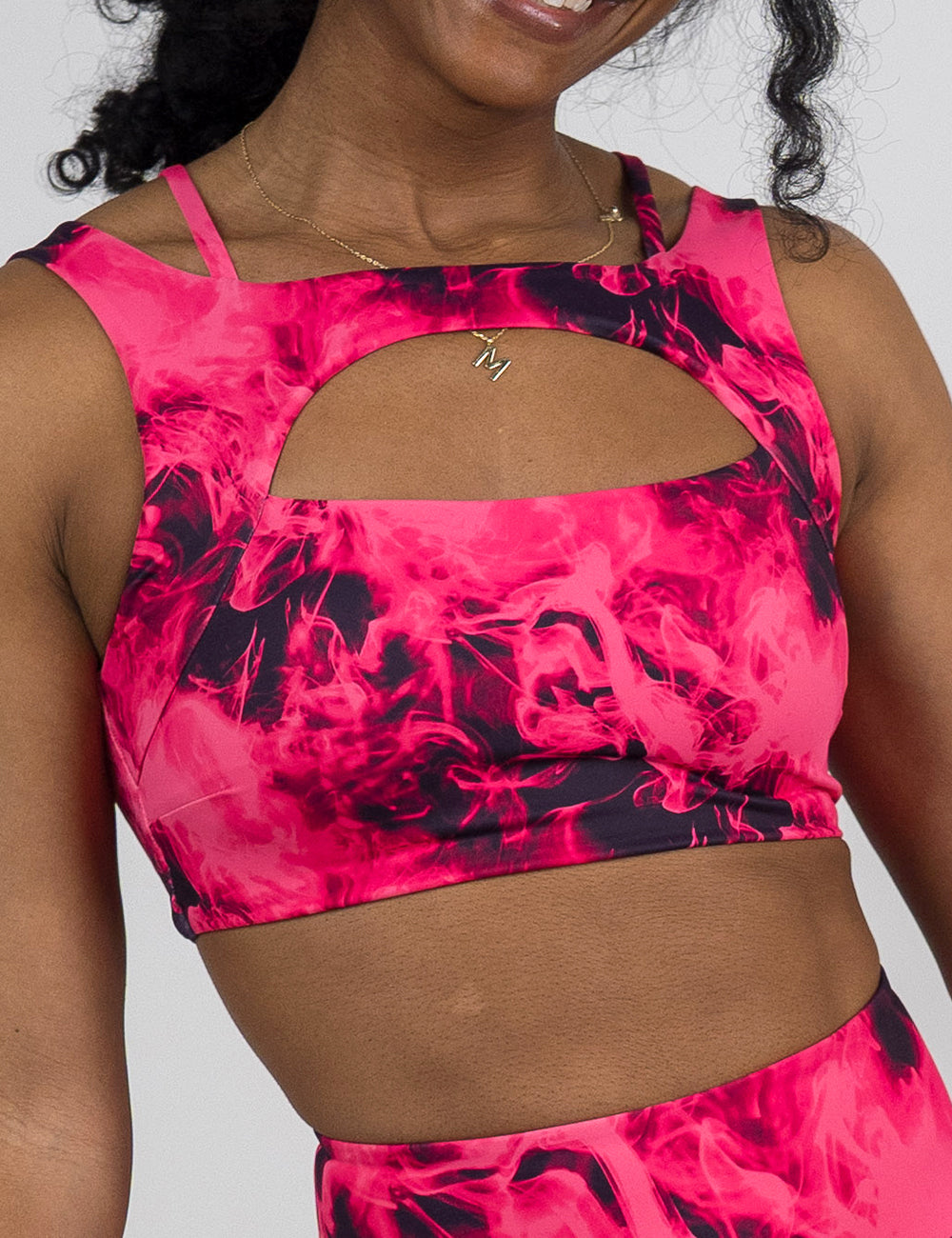 front of the pink smoke pattern vista bra against a white background 