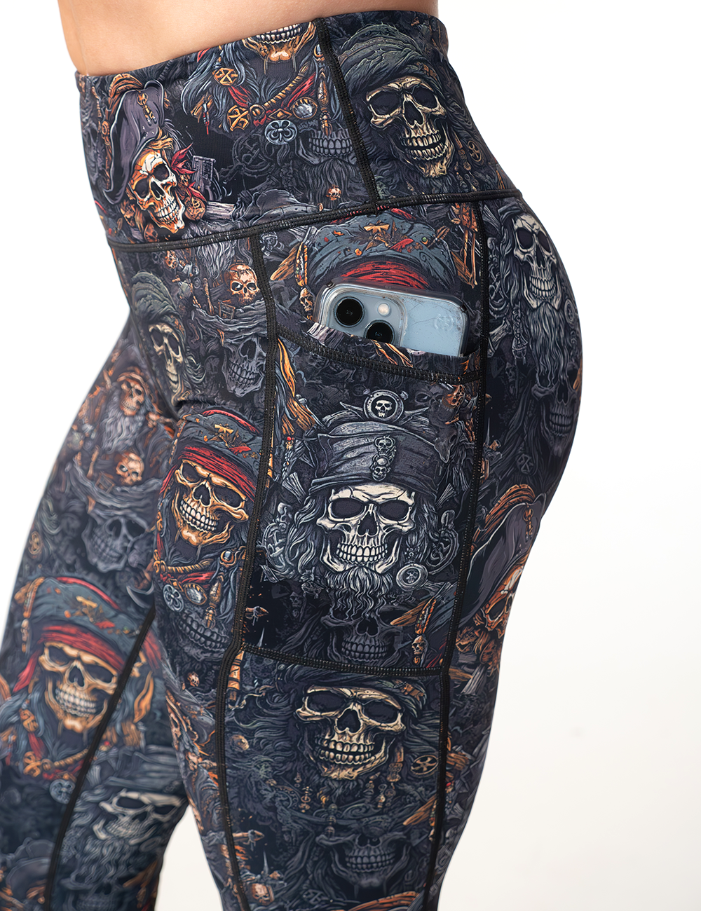 close up of the pirate skull leggings pocket holding a phone