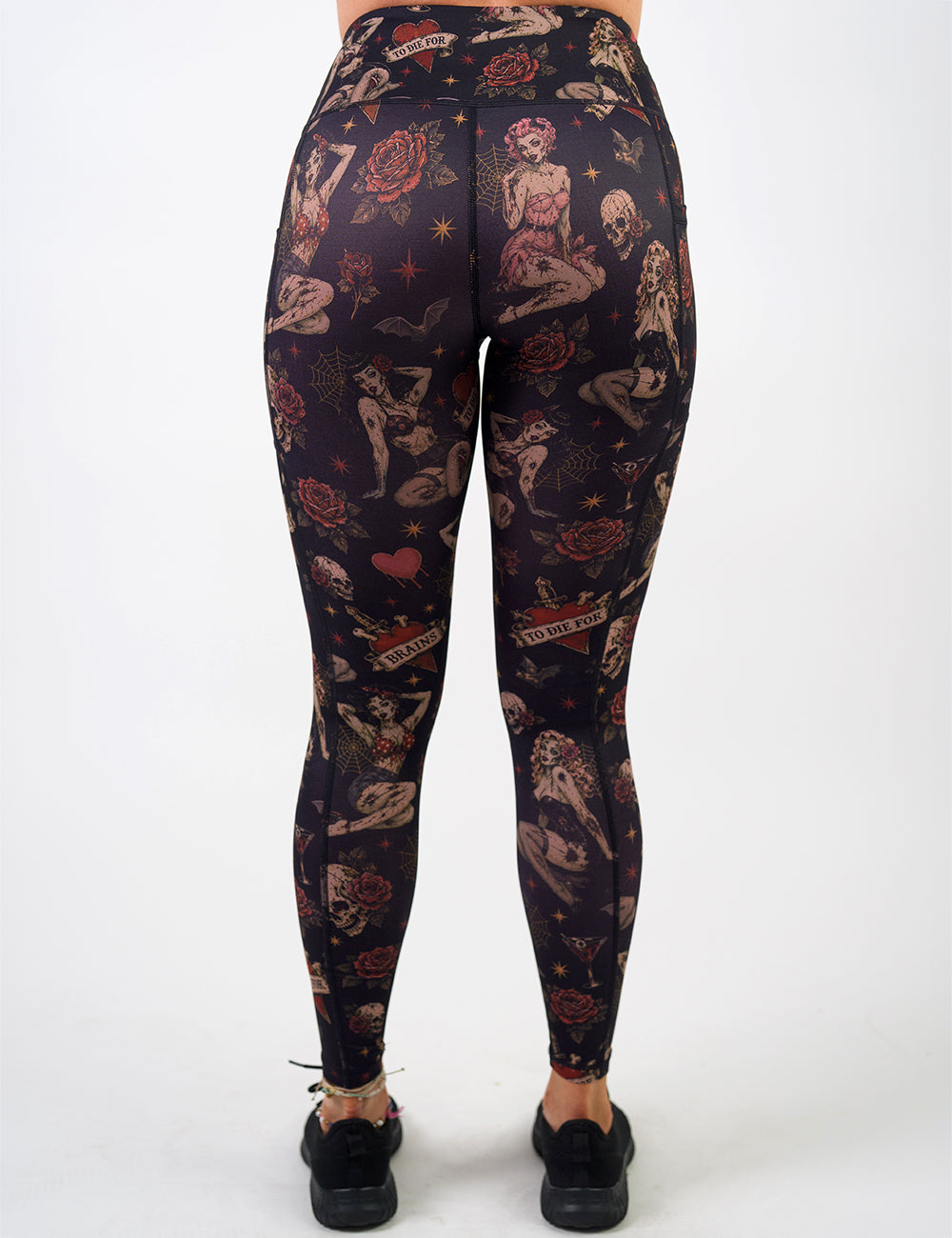 back of the zombie girls with pin up hair and traditional tattoo designs full length leggings against a white background