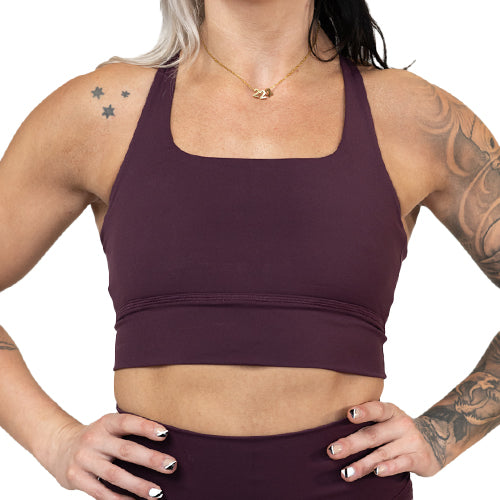 front of solid plum colored sports bra