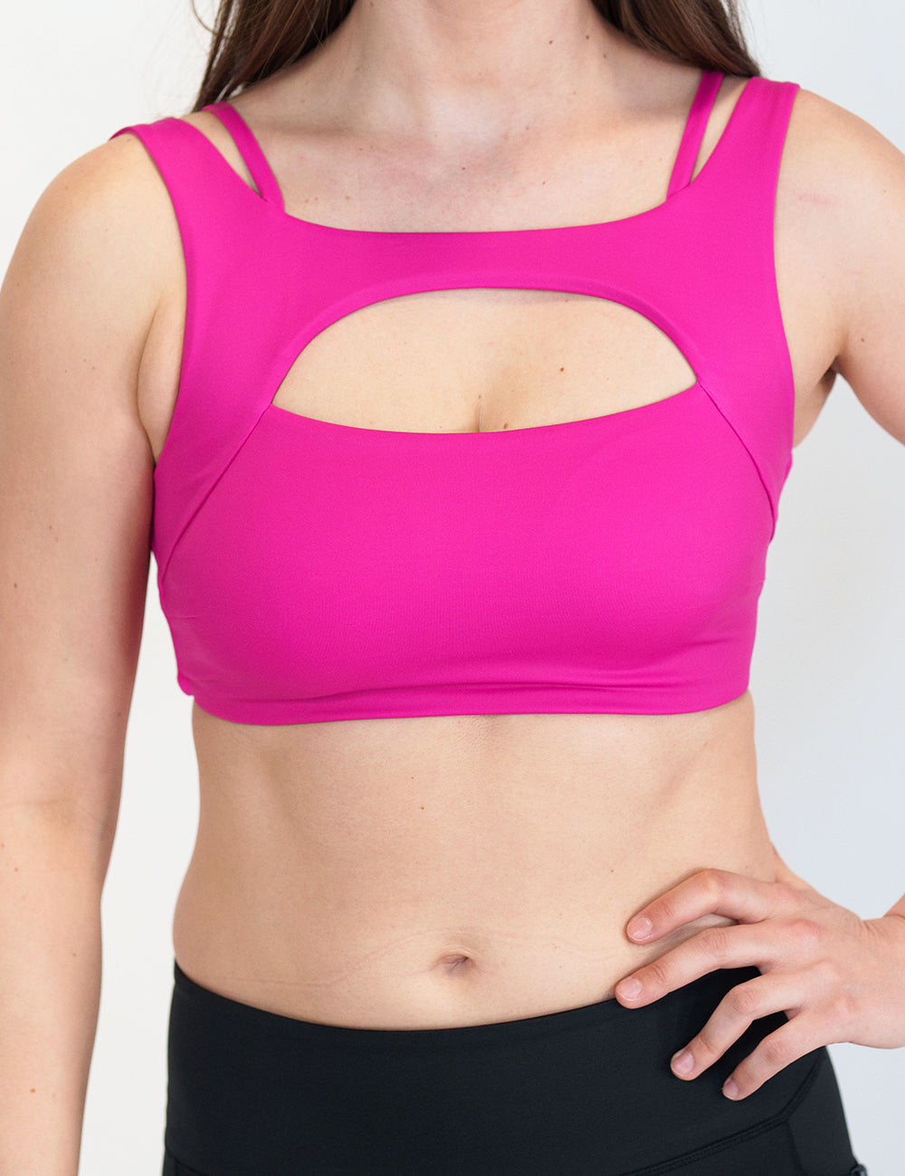 model wearing a hot pink sports bra