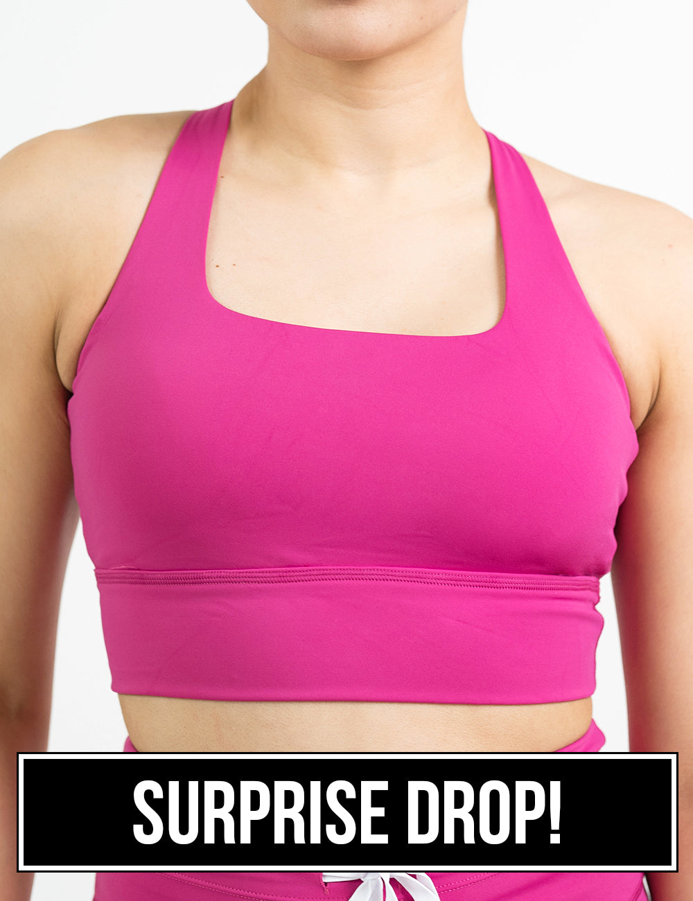 front of the pink longline bra against a white background, surprise drop