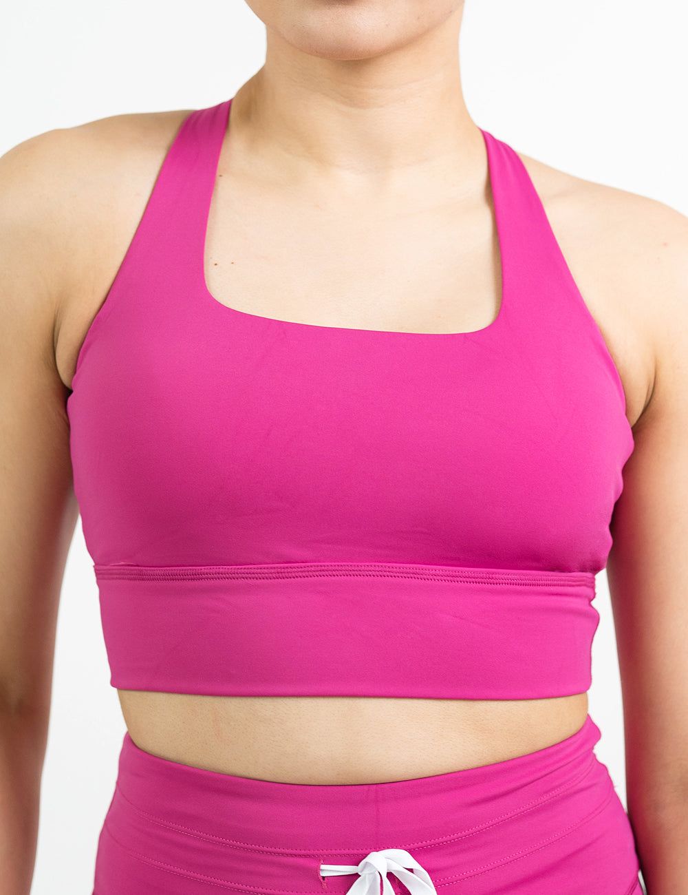 front of the pink longline bra against a white background