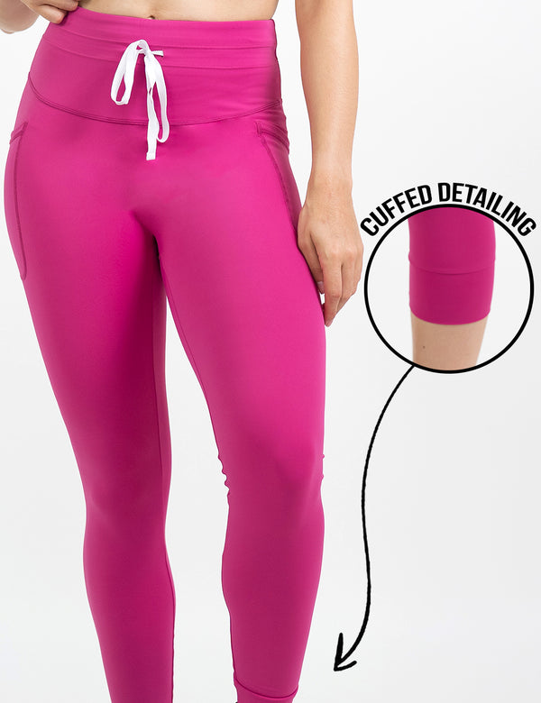 front of the pink omni style legging with a white draw string against a white background, including a close up of the cuffed detailing
