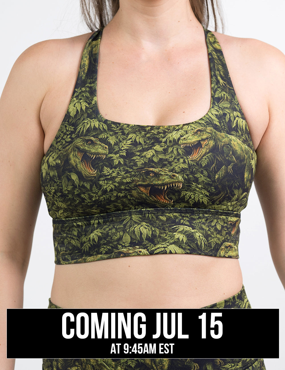 front of the t-rex in a rainforest longline bra against a white background, coming jul 15