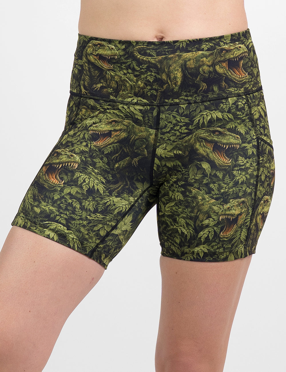 front of the 5 inch t-rex in a rainforest shorts against a white background