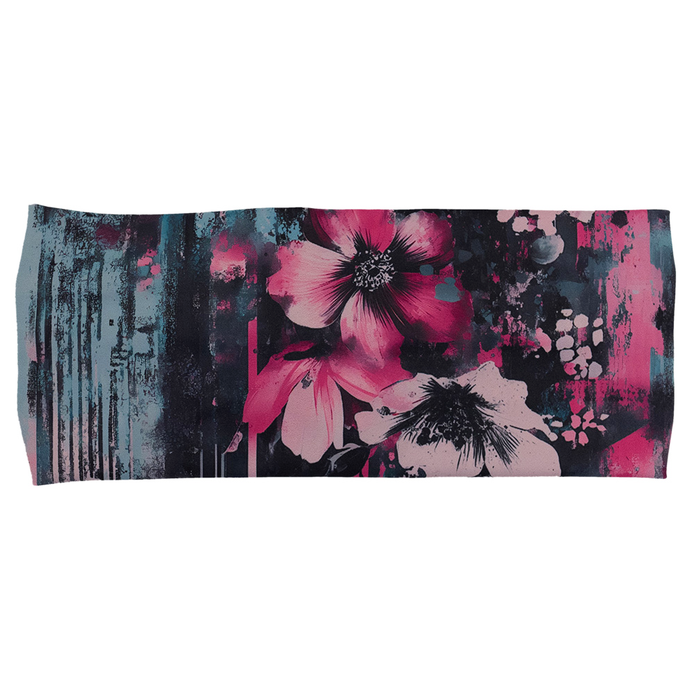 front of the pink flowers against a bold teal and pink striped background pattern headband against a white background
