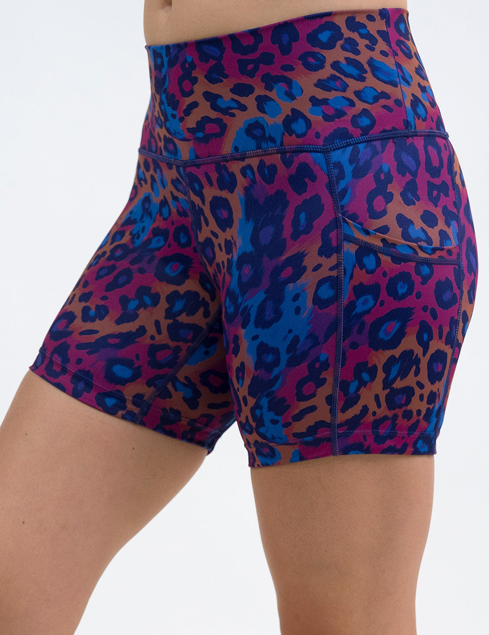 front of the 5 inch  yellow, red, and blue leopard print shorts against a white background