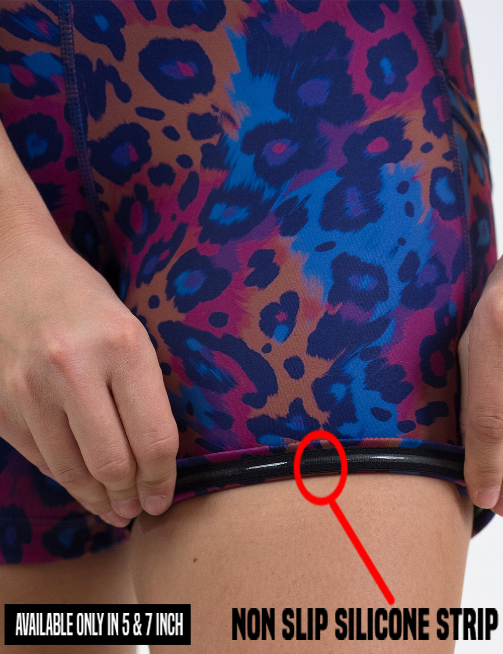 close up of the  yellow, red, and blue leopard print shorts rolled up to show the non slip silicone strip lining found in the 5 and 7 inch shorts
