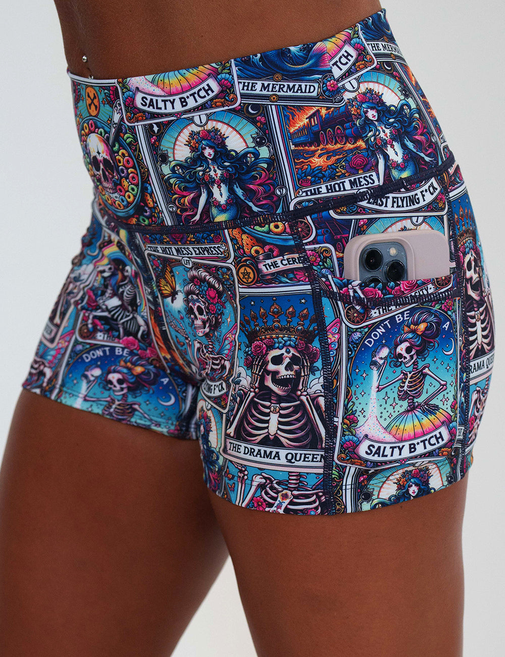 close up of the 2.5 inch tarot card skeletons shorts with a phone in the pocket
