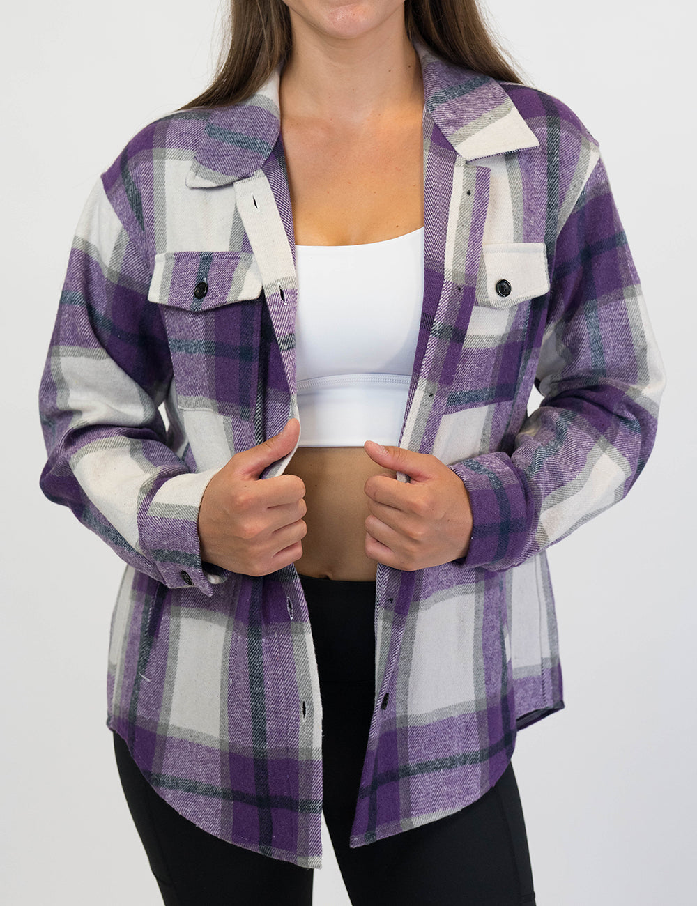 front of the purple plaid shacket against a white background