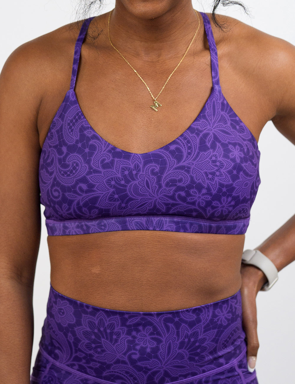 front of purple flower artwork move free bra against a white background