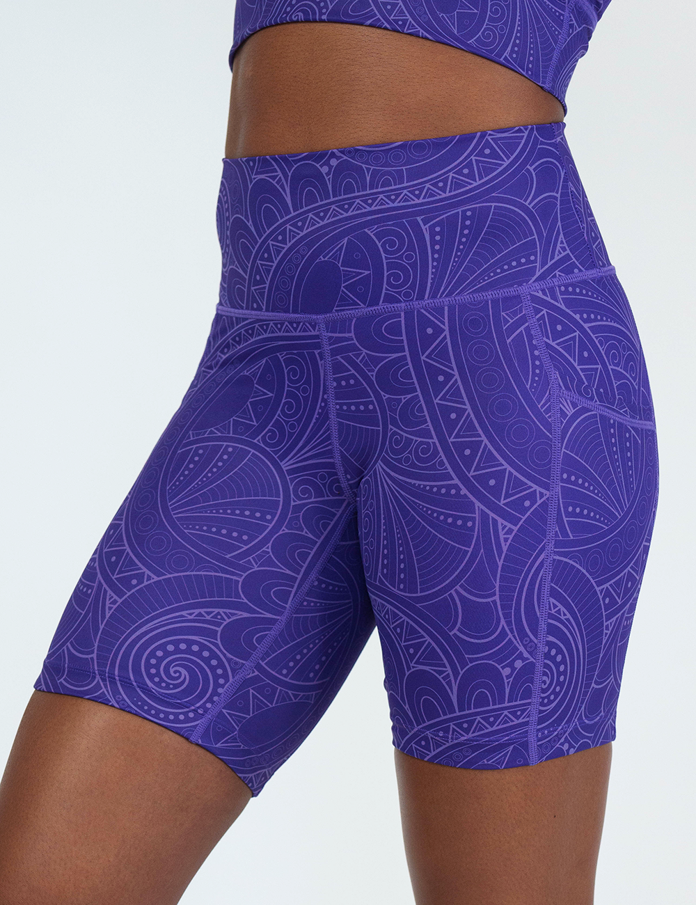 front of the purple 7 inch shorts with a white swirl outlined pattern