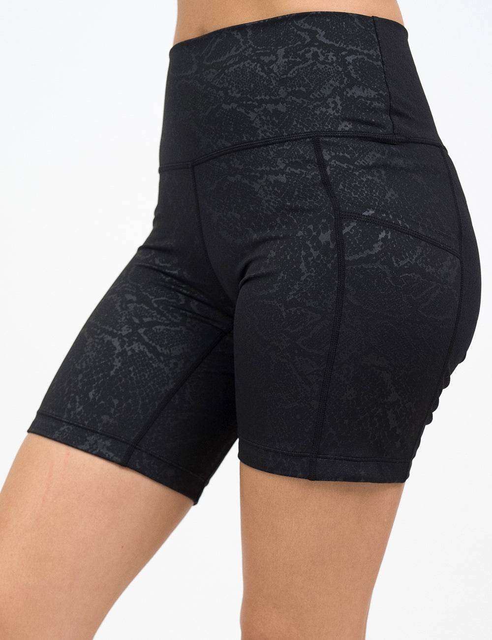 front of the 7 inch dark python print shorts against a white background