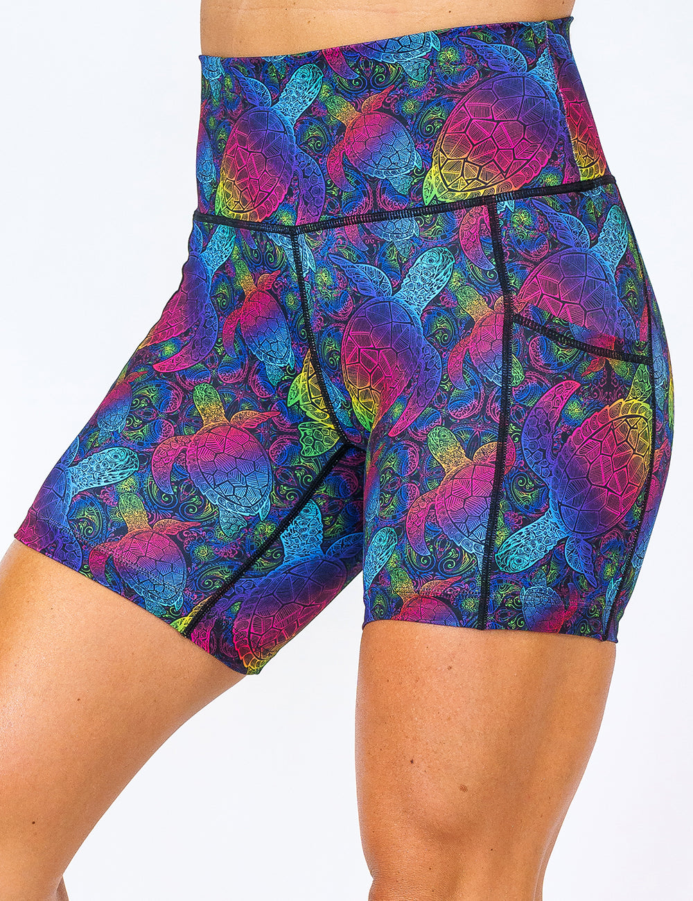 front of the pink, yellow, blue, green and purple ombre turtle print 5 inch shorts against a white background