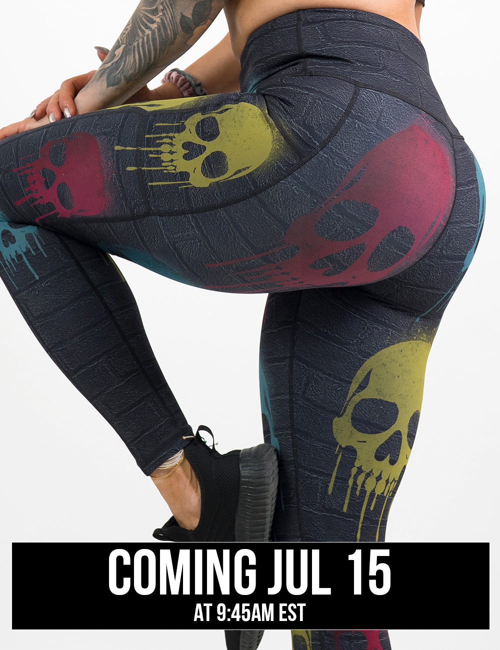 back of the black brick full length leggings with spray painted red, yellow, and blue skulls all over against a white background, coming july 15th