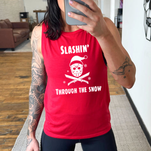 model wearing red muscle tank with black slashin through the snow design on it