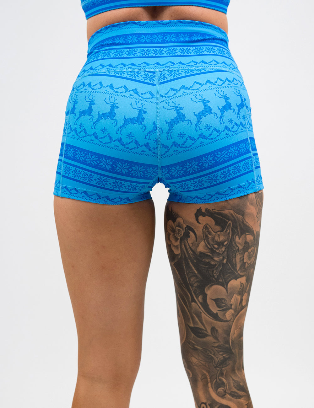 back of the 2.5 inch blue patterned shorts with reindeer design against a white background