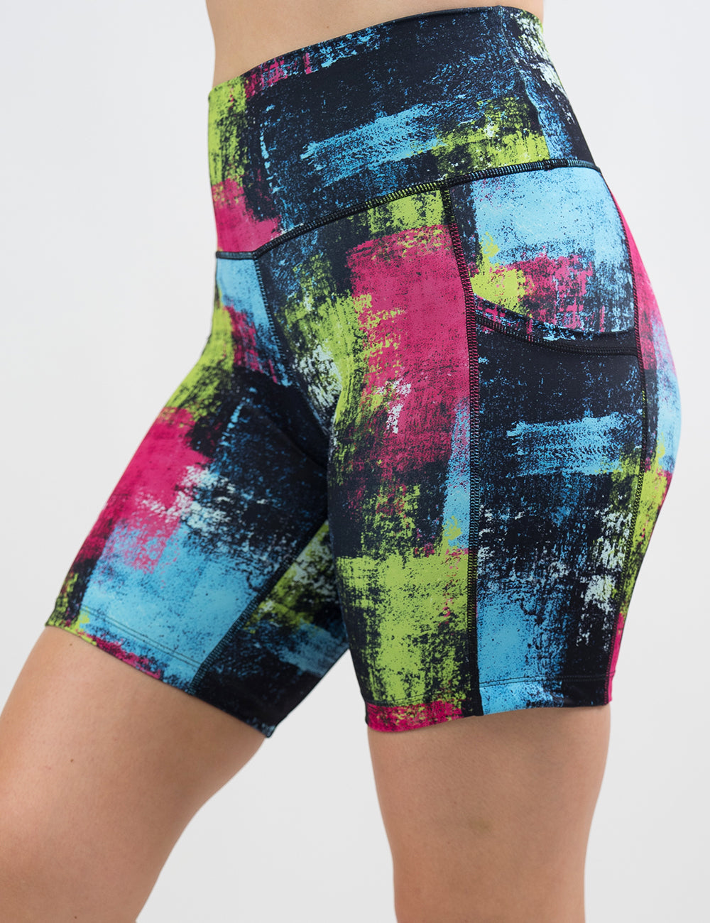 front of the green, pink, and blue grunge pattern 7 inch shorts against a white background
