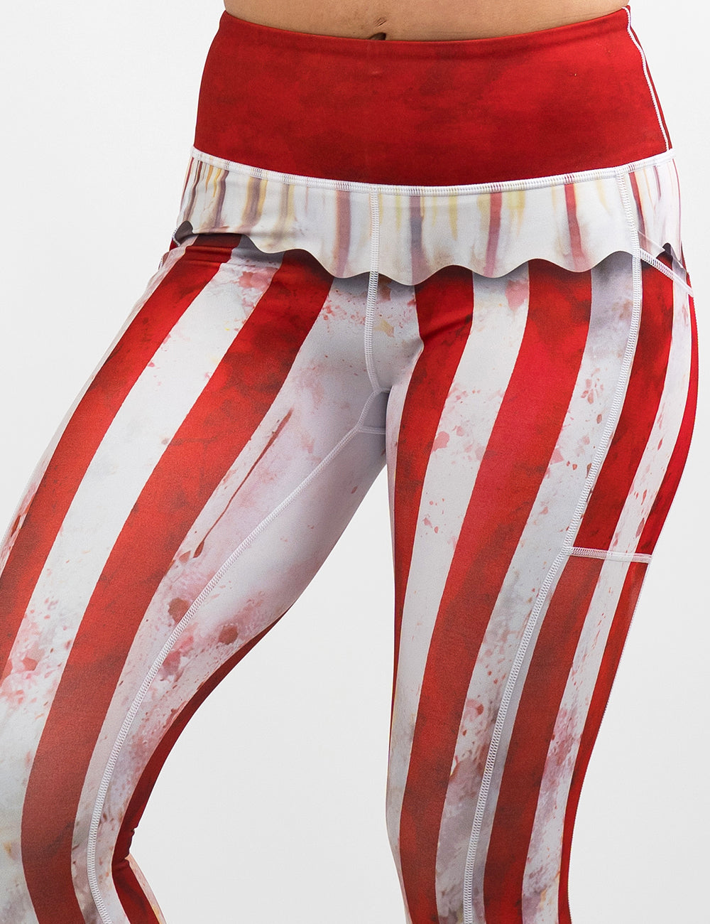 front of the bloody red and white stripes circus leggings against a white background