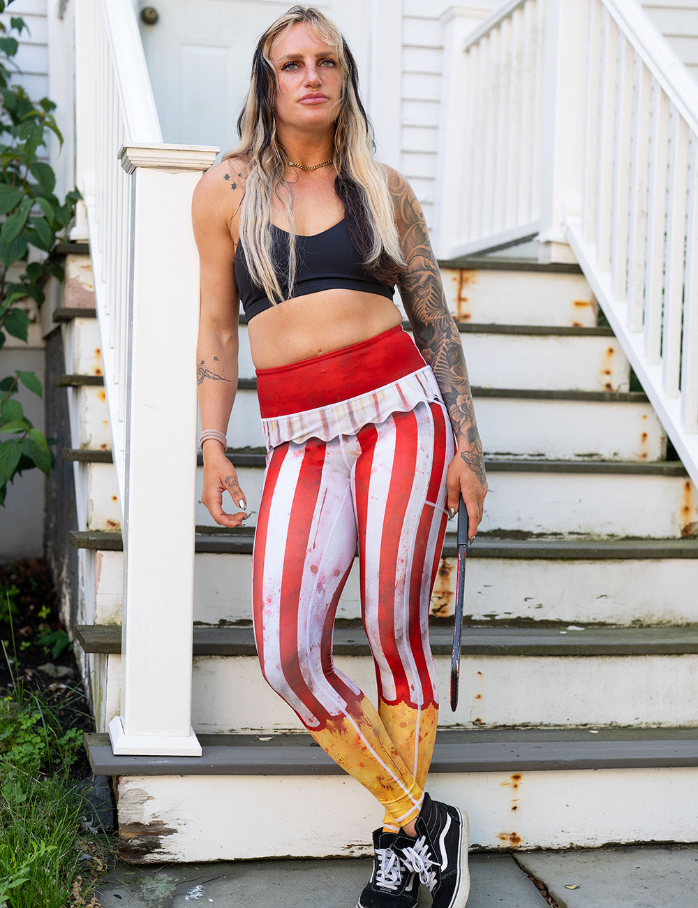 model wearing the bloody red and white stripes circus full length leggings