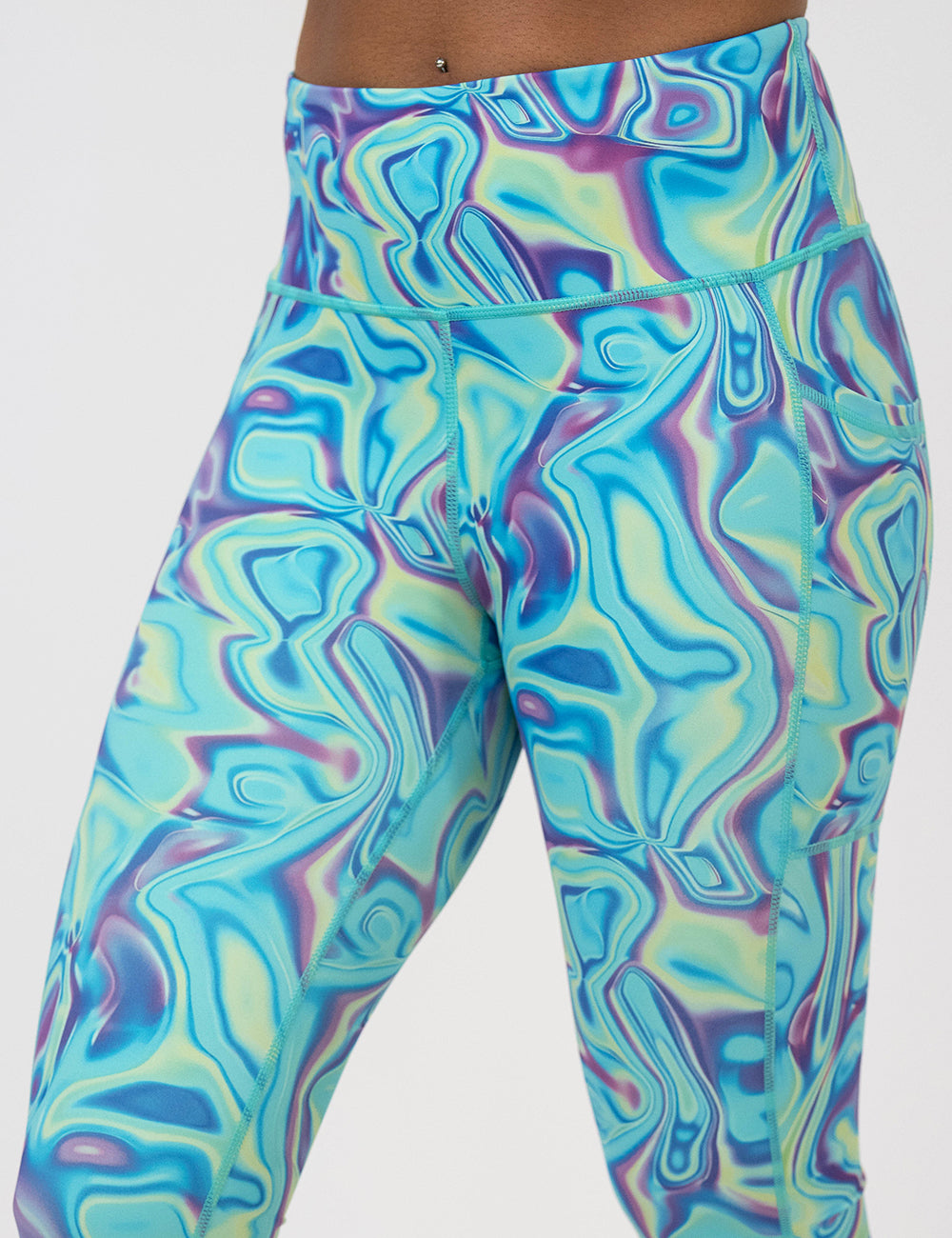 Multicolored swirl patterned leggings on a white background