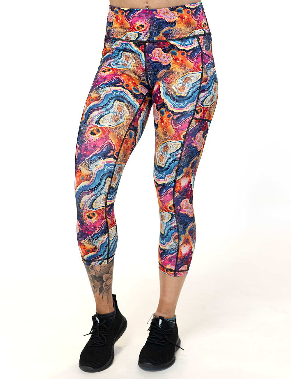 model wearing the capri colorful marble pattern leggings facing the front against a white background
