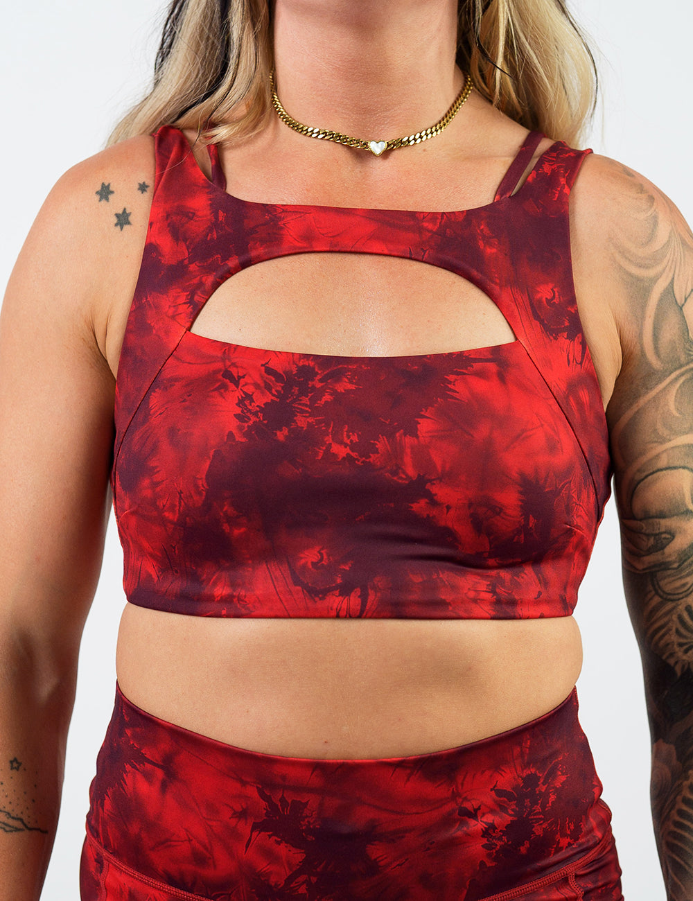 front of the red tie dye sports bra against a white background