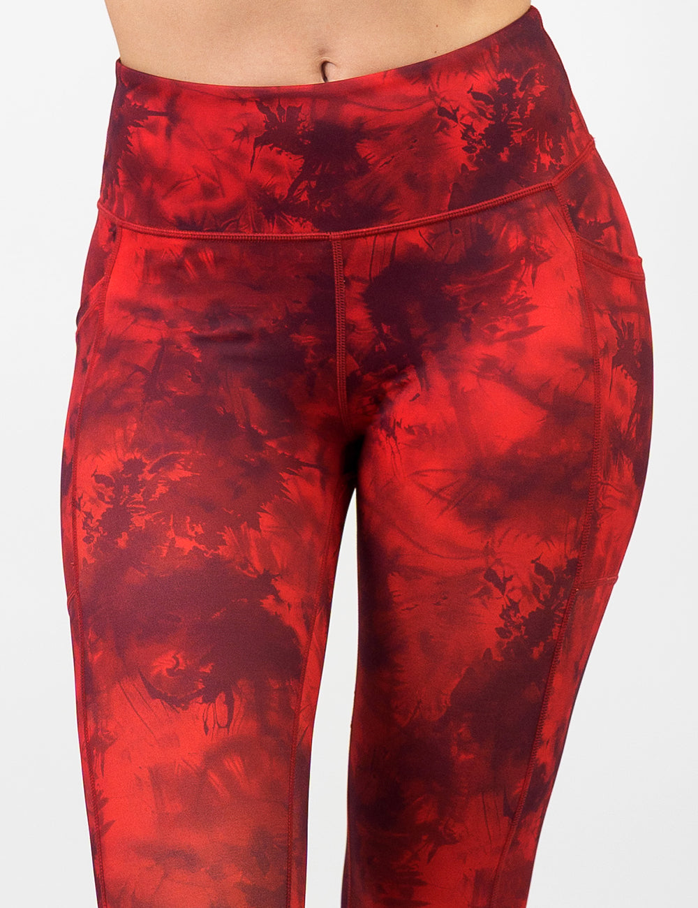front of the dark red tie dye leggings against a white background