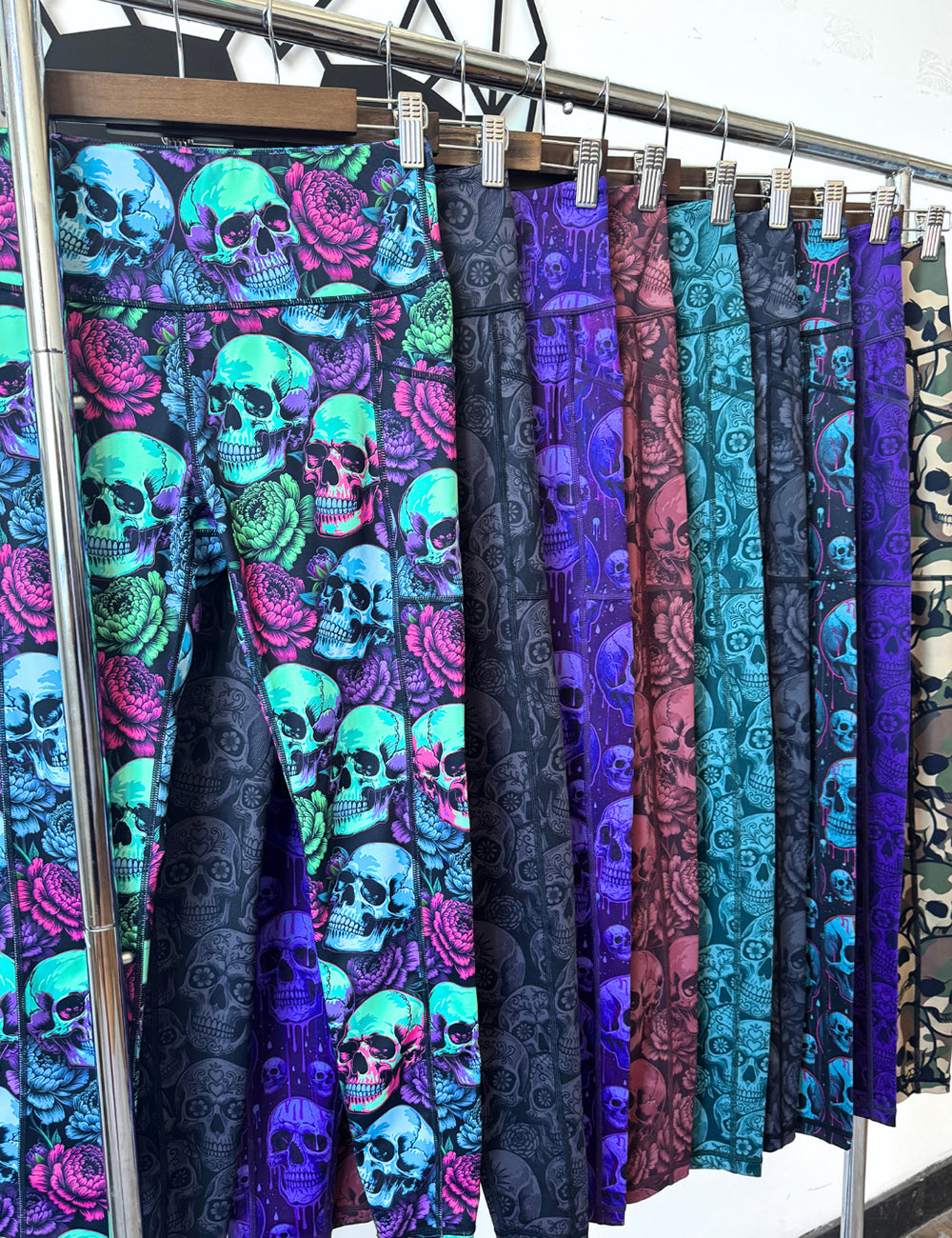 close up of the new sealed series leggings skull designs hanging on a rack