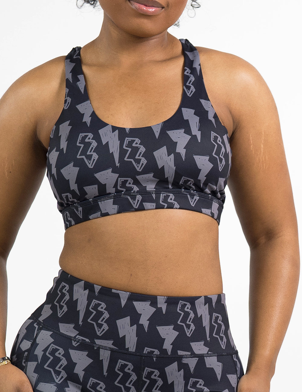front of the black butterfly back bra with a grey lightning bolt pattern against a white background