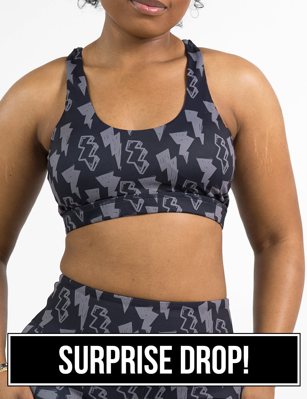 front of the black butterfly back bra with a grey lightning bolt pattern against a white background, surprise drop