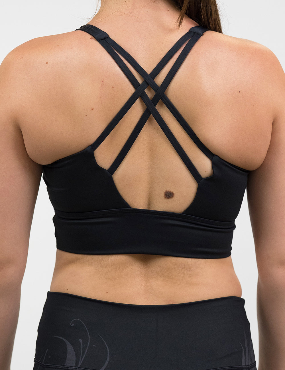 back of the back bra with a phoenix design on it against a white background