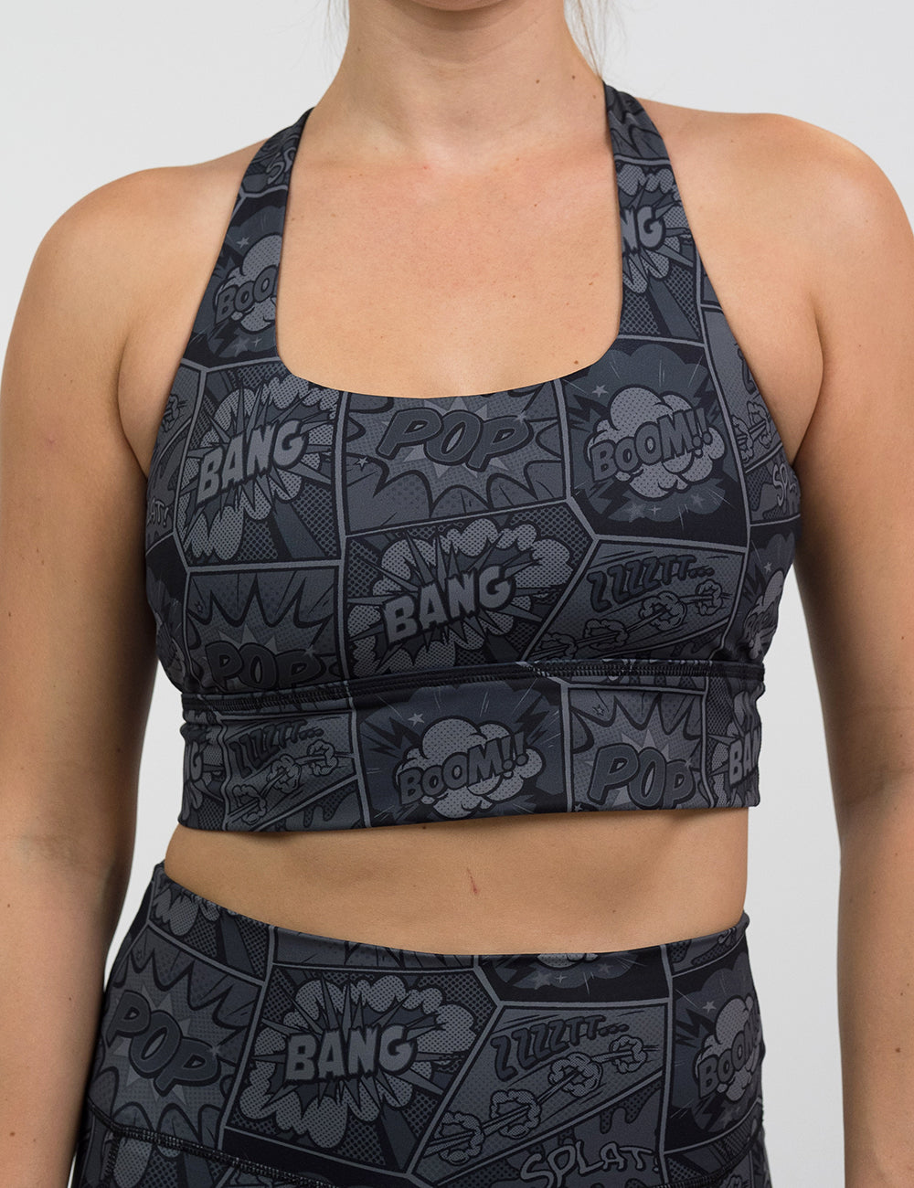 front of the black and grey comic book print long line bra against a white background