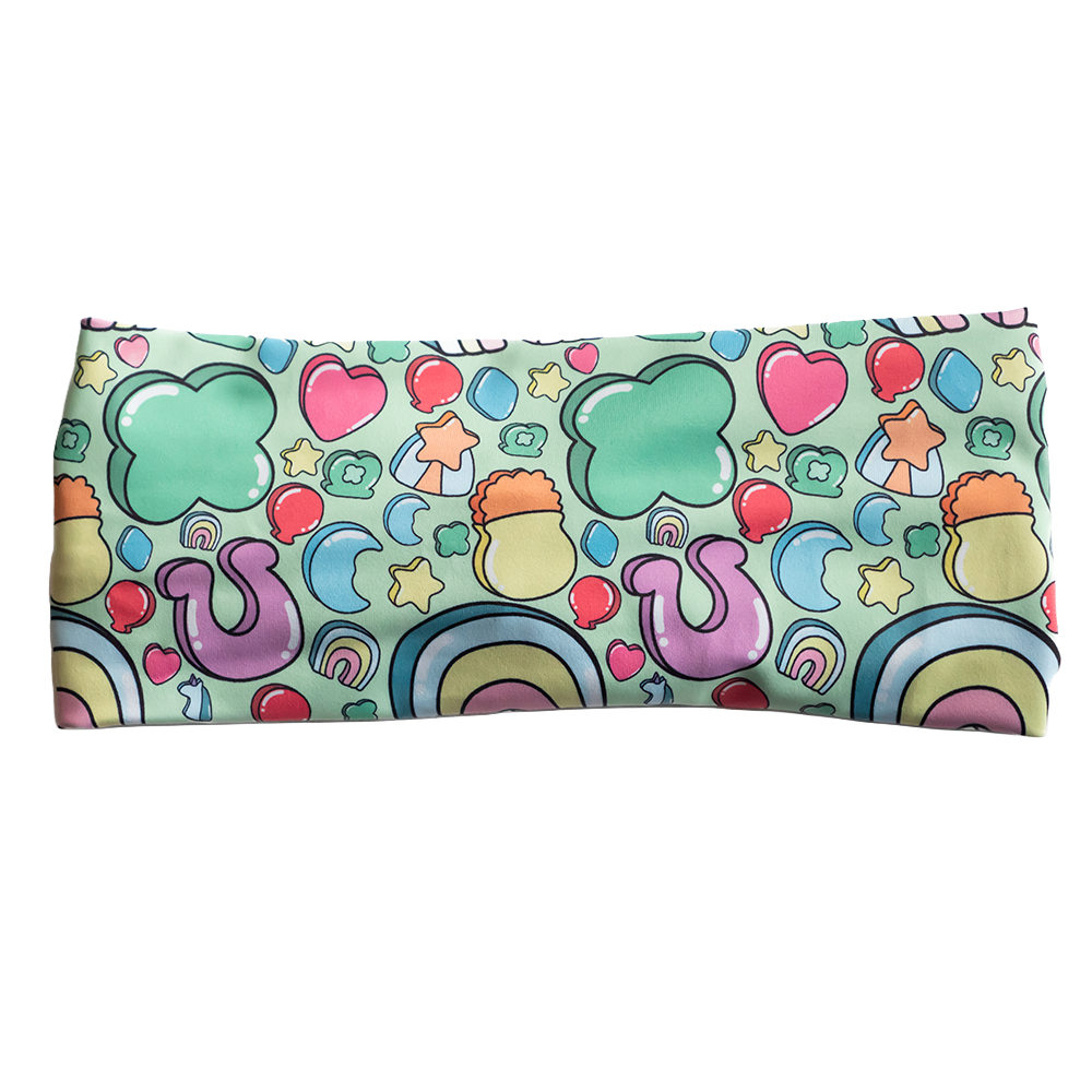 headband with St Patrick's day inspired charms print facing the front against a white background