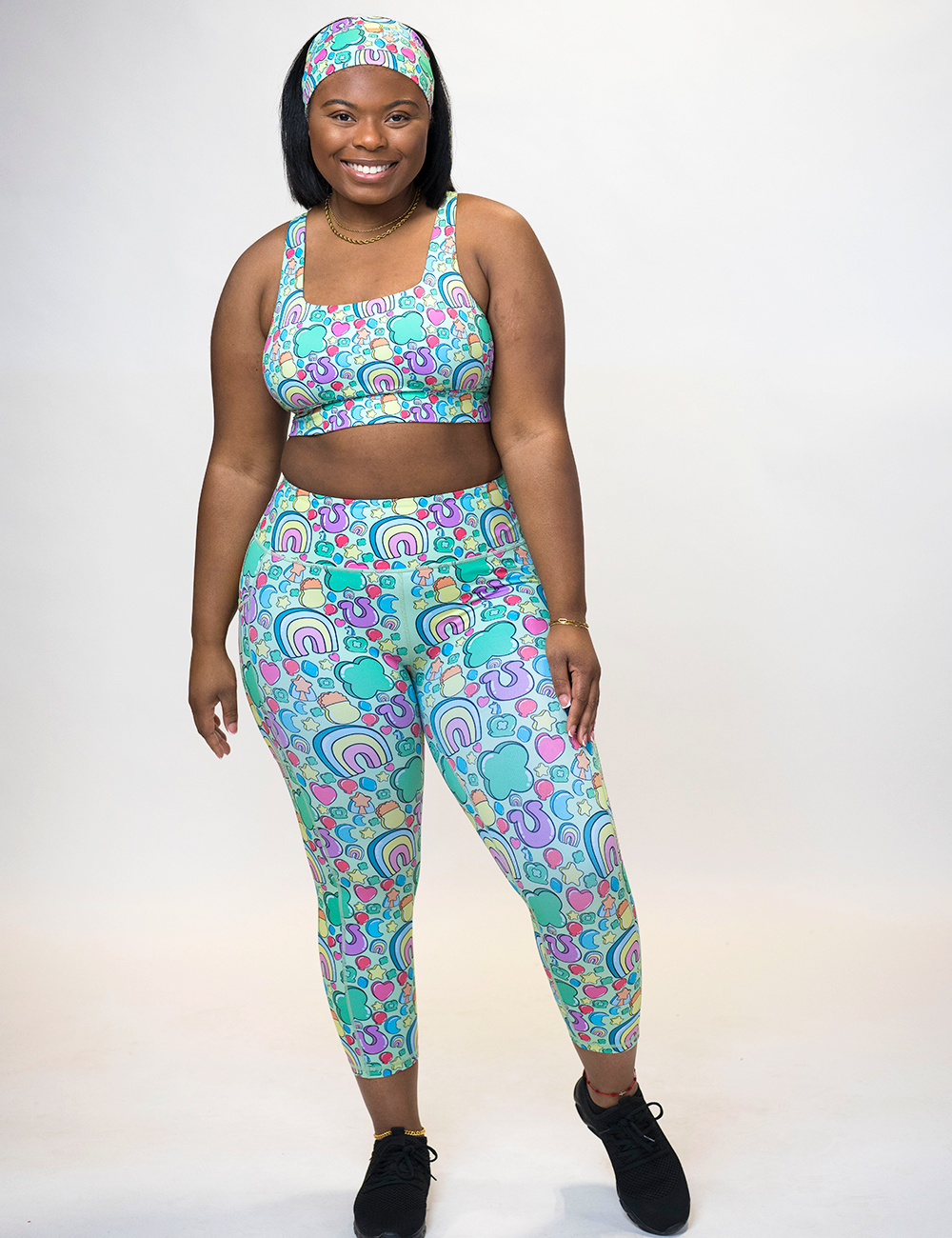 model wearing the St Patrick's day inspired charms print capri leggings against a white background