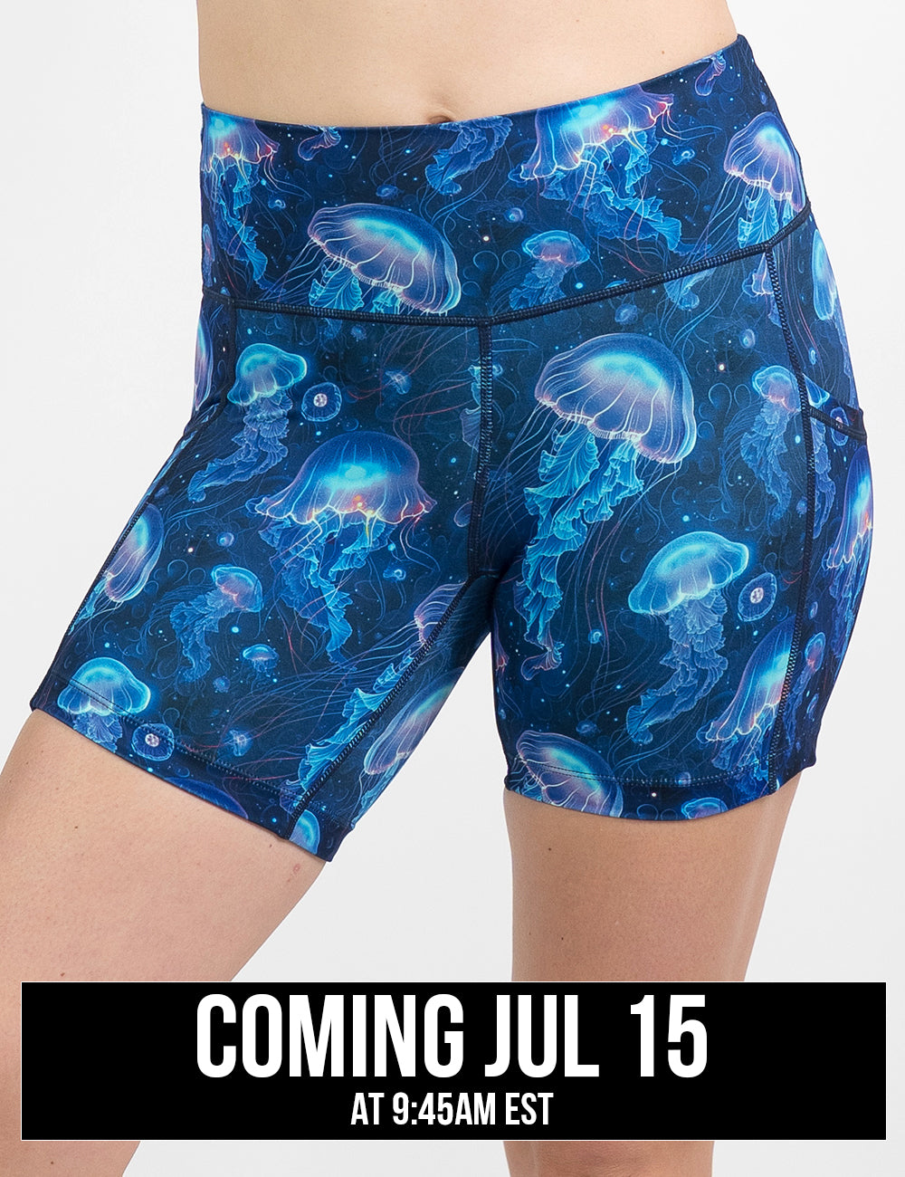 front of the 5 inch blue jellyfish patterned shorts against a white background, coming july 15th