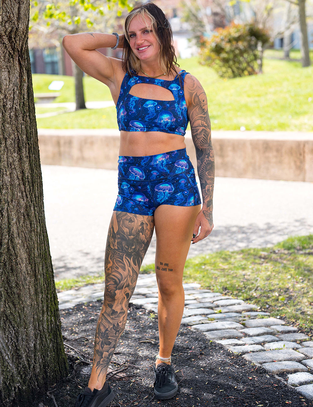 model wearing the 2.5 inch blue jellyfish pattern shorts and bra in the park