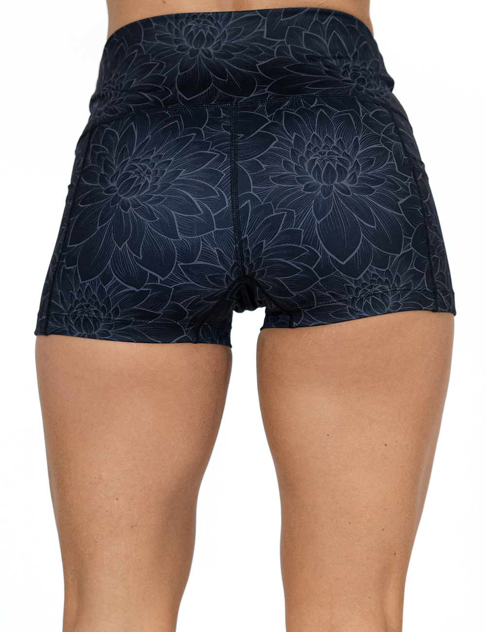 back of the 2.5 inch etched lotus flower against a black background shorts