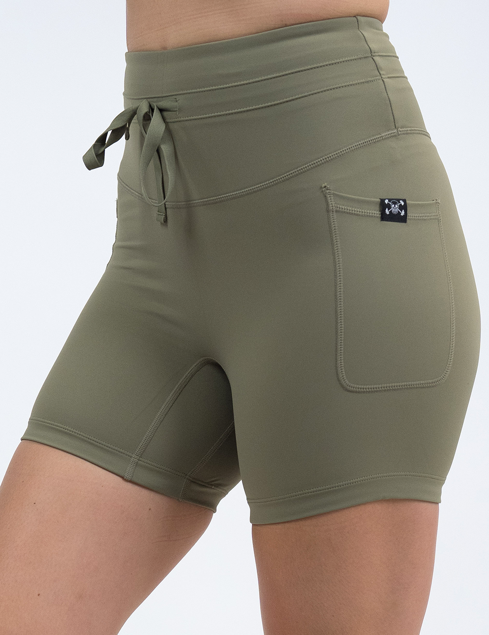 front of the 5 inch solid green omni shorts against a white background