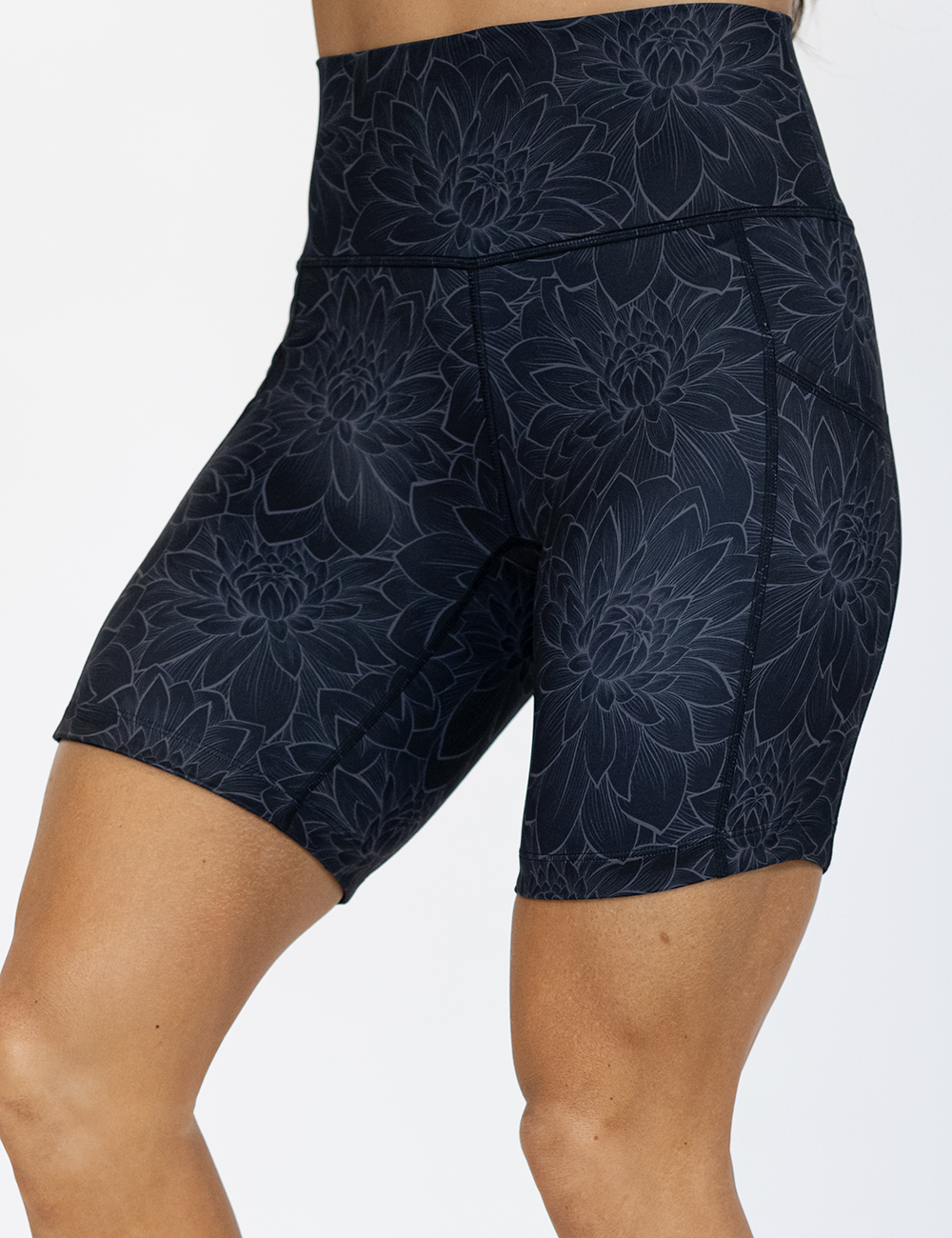 5 inch etched lotus flower against a black background shorts facing the front against a white background