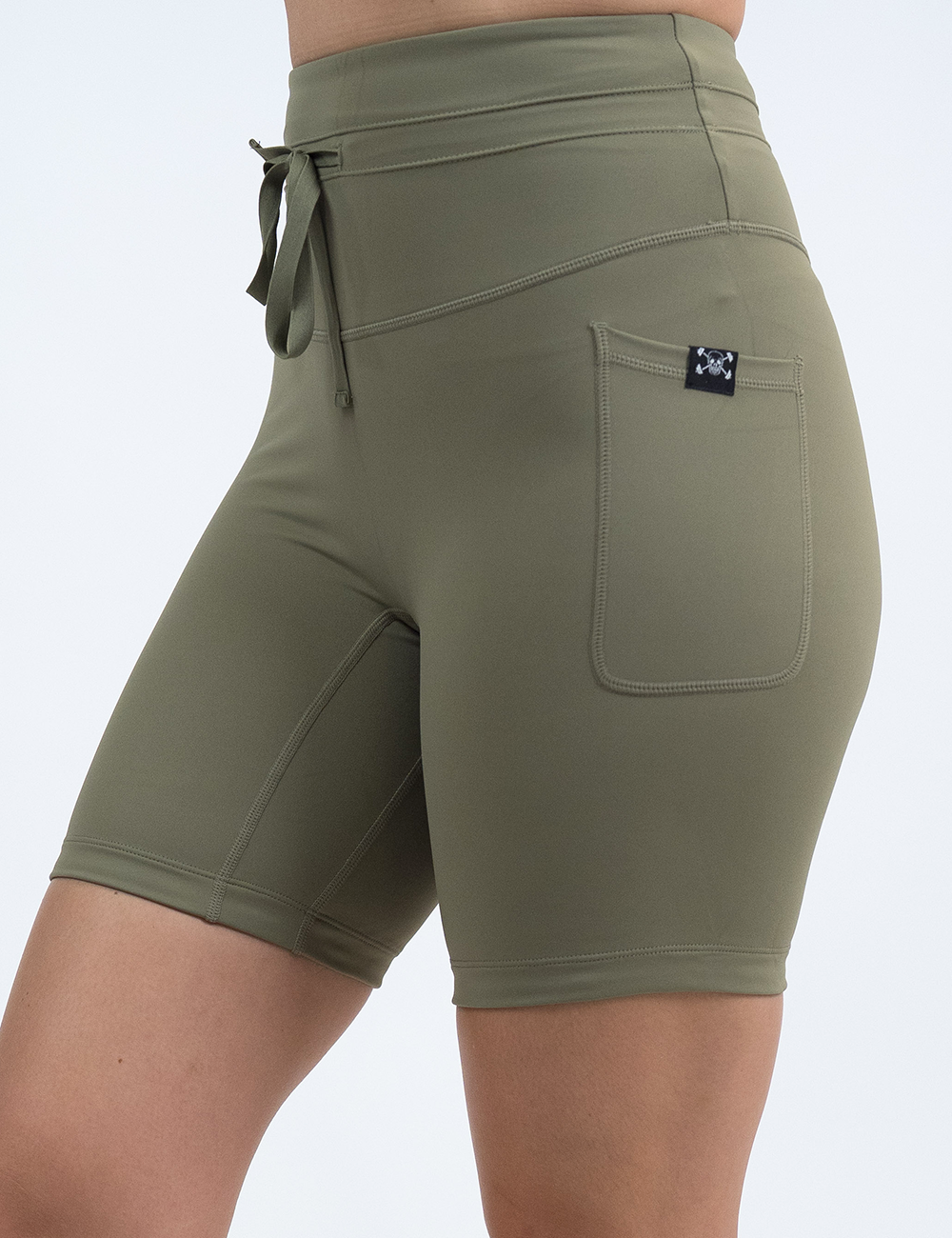 front of the 7 inch omni solid green shorts against a white background