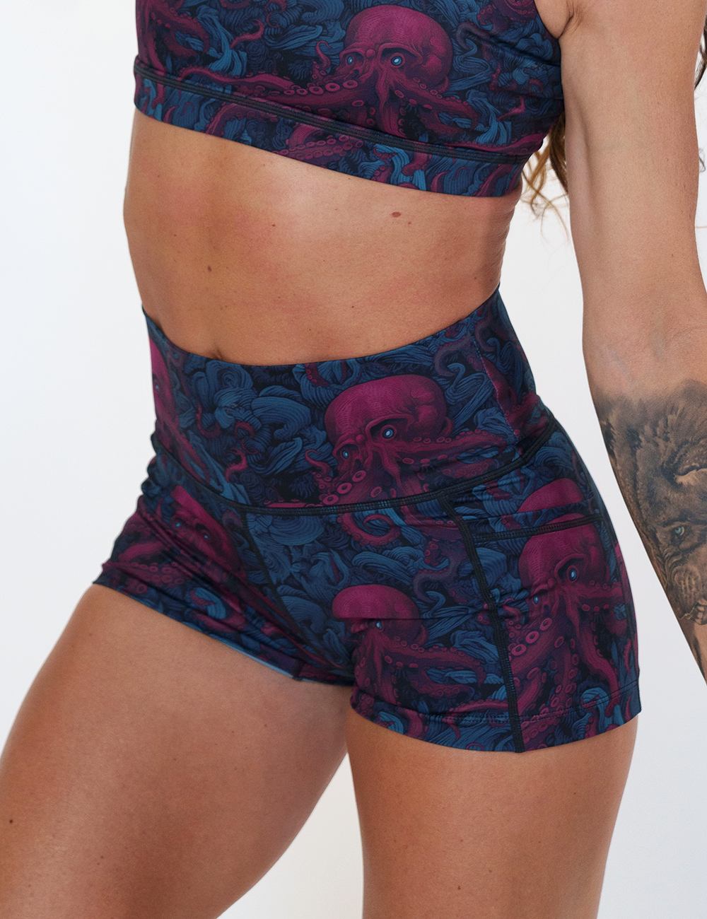 close up of the 2.5 inch maroon octopus with blue eyes shorts against a white background