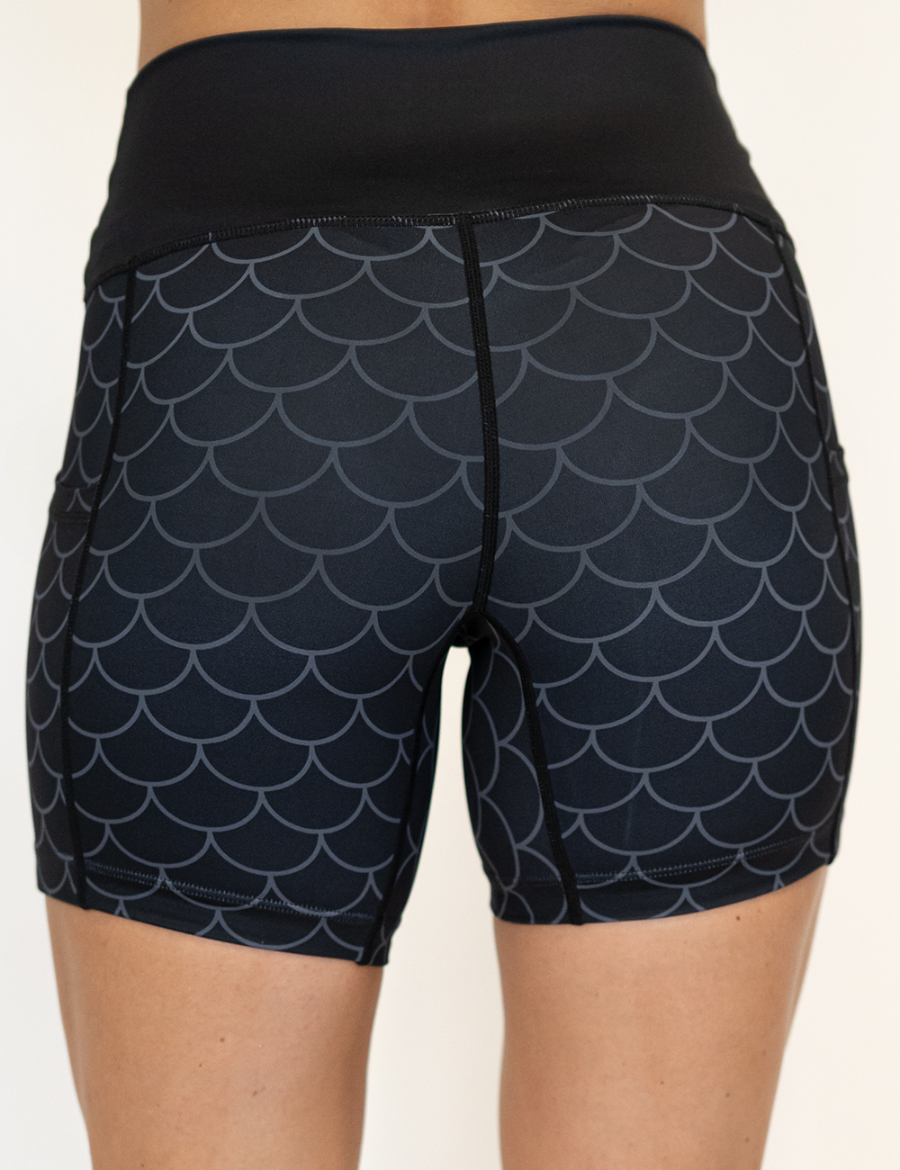 back of the dragon scale outline against a dark background pattern 5 inch shorts against a white background