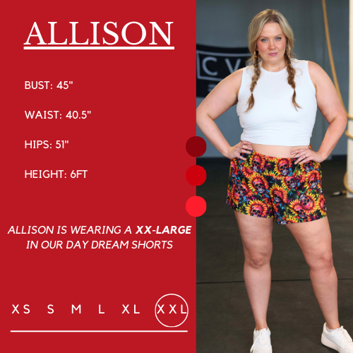Model's measurements of 45 inch bust, 39 inch waist, 50 inch hips, and height of 6 foot. She is wearing a xxl in the shorts