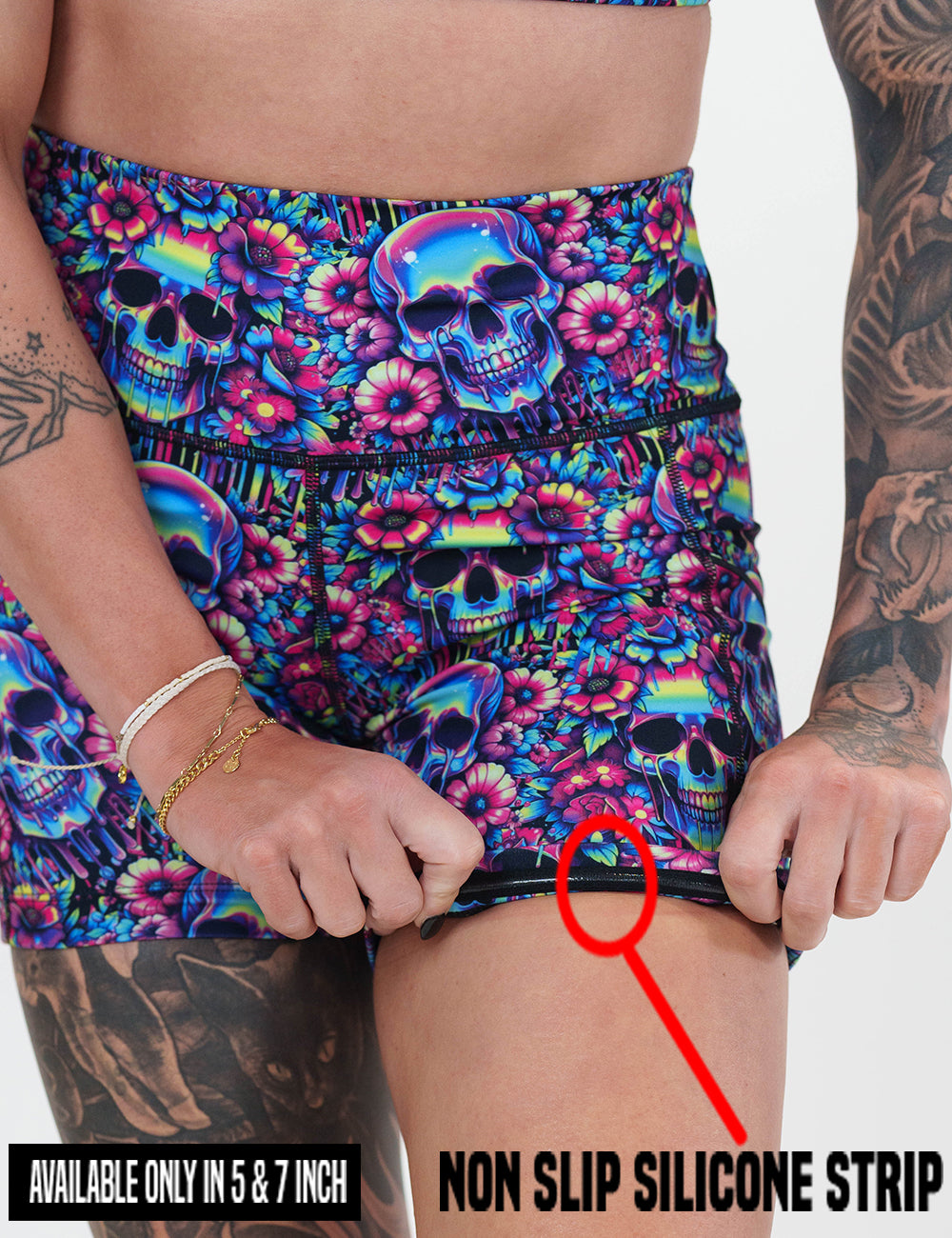 close up of the neon skull print shorts rolled up to show the non slip silicone strip found in the lining of the 5 and 7 inch shorts