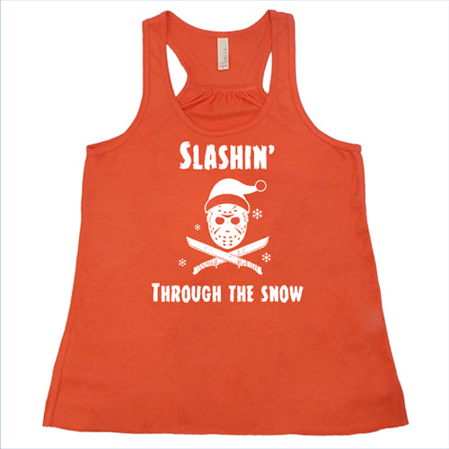 coral racerback tank top with white lettering that says "slashin through the snow"
