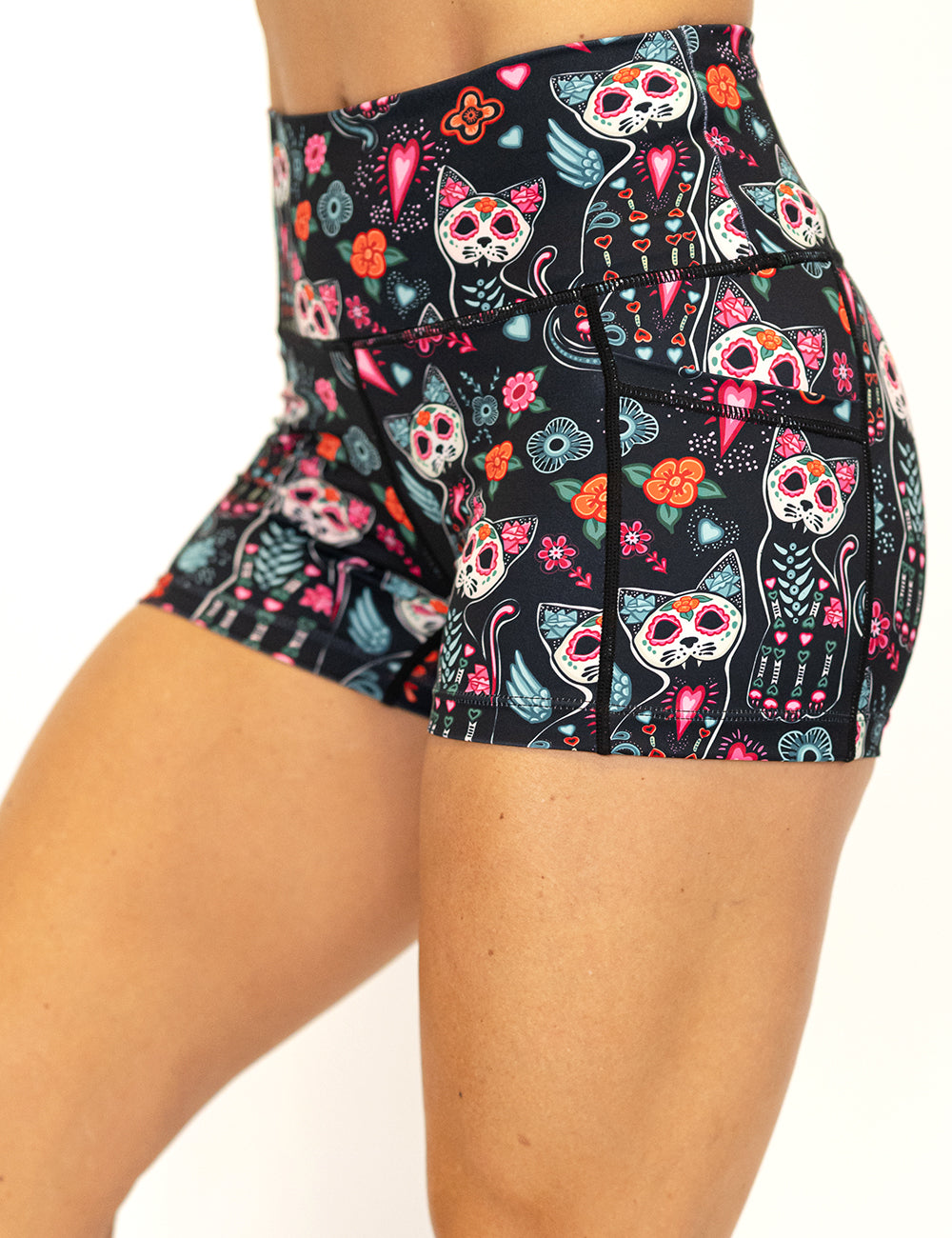 front of the 2.5 inch shorts with a colorful cat skull and floral design