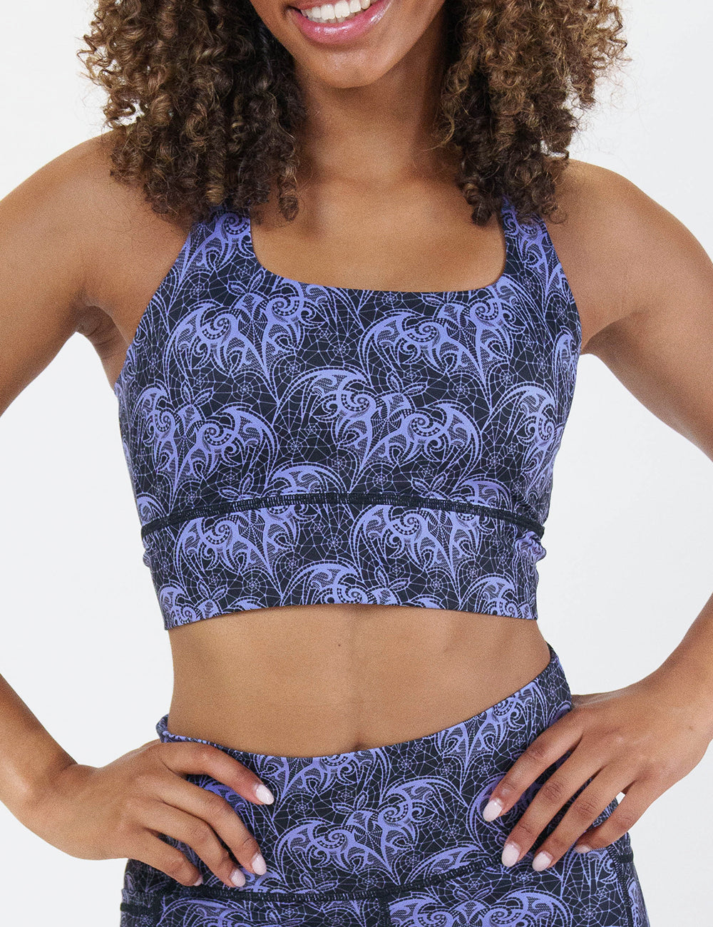 front of the purple bat lace sports bra against a white background
